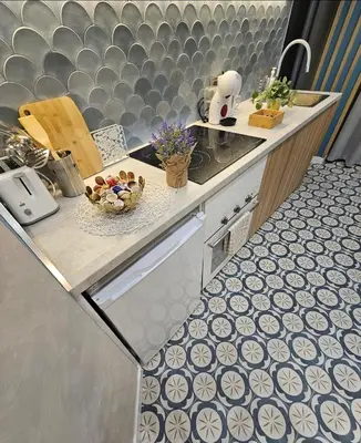 a kitchen with a counter with a bowl of fruit on it at Lounge garden sea relax in Valencia