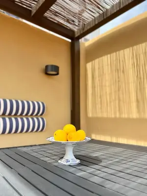 a plate of lemons on a table in a room at El Rincón de María Vicenta in Valencia