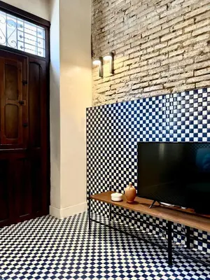 a living room with a flat screen tv on a wall at El Rincón de María Vicenta in Valencia