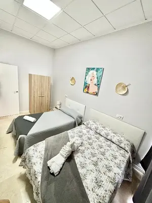 two beds in a room with two bedsvisor at Apartamentos Bobal Requena in Requena
