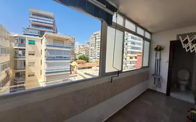 a room with a window with a view of a city at Tavernes de Valldigna Chez Svetlana in El Brosquil