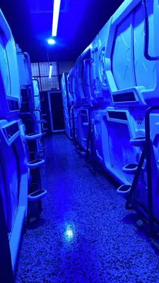 an empty bus with blue lights in the aisle at CAPSULE INN VALENCIA Hostel in Valencia
