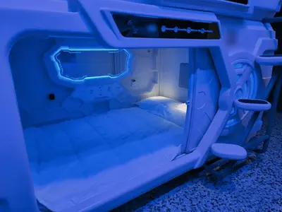 a small bed in the back of a vehicle at CAPSULE INN VALENCIA Hostel in Valencia