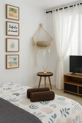 a bedroom with a bed and a tv and a table at Del Mar three bed flat. in Puerto de Sagunto