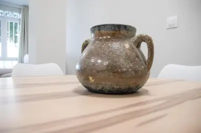a brown vase sitting on top of a table at Nautical Flats by Concept in Valencia