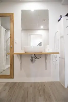 a bathroom with a sink and a mirror at Nautical Flats by Concept in Valencia