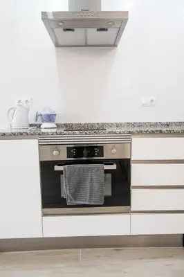 a kitchen with a stove and a counter top at Nautical Flats by Concept in Valencia