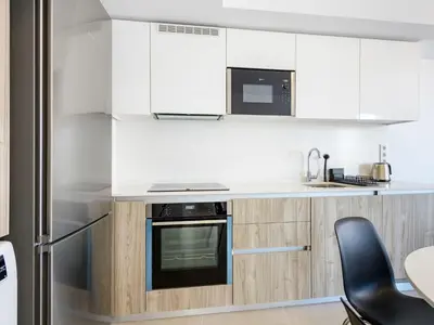 a kitchen with white cabinets and a stove top oven at Apartment Gran Canet by Interhome in Canet de Berenguer