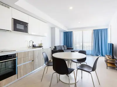 a kitchen and living room with a table and chairs at Apartment Gran Canet by Interhome in Canet de Berenguer