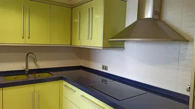a kitchen with lime green cabinets and a sink at Faro Cullera primera Linea Playa del Dosel in Faro de Cullera