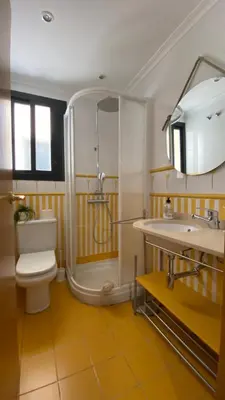 a bathroom with a shower and a toilet and a sink at Residencial Playa Canet in Canet de Berenguer