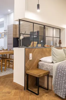 a living room with a bed and a table at La Peregrina in Valencia