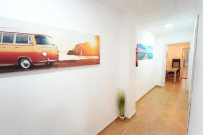 a living room with a picture of a van on the wall at Fantastic apartment near beach & Science City in Valencia