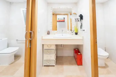a bathroom with a sink and a toilet at Fantastic apartment near beach & Science City in Valencia