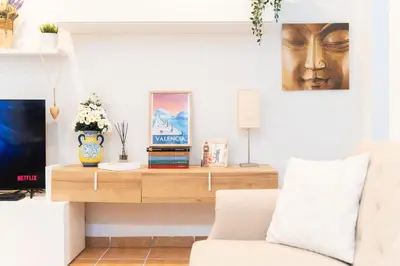 a living room with a table and a couch at Fantastic apartment near beach & Science City in Valencia