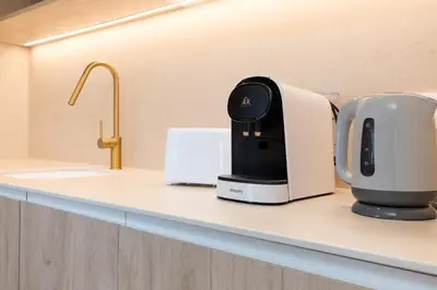 a coffee maker sitting on a counter in a kitchen at Apartamentos Las Ciencias H in Valencia