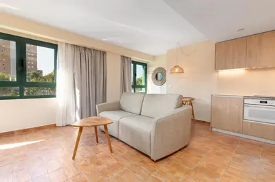 a living room with a couch and a table at Apartamentos Las Ciencias H in Valencia