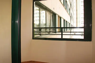 a window on the side of a building with a balcony at Apartamentos Las Ciencias A in Valencia