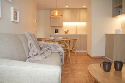 a living room with a couch and a table at Apartamentos Las Ciencias F in Valencia