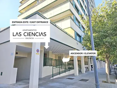 a building with two street signs in front of it at Apartamentos Las Ciencias F in Valencia