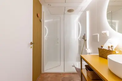 a bathroom with a shower and a sink at Apartamentos Las Ciencias J in Valencia
