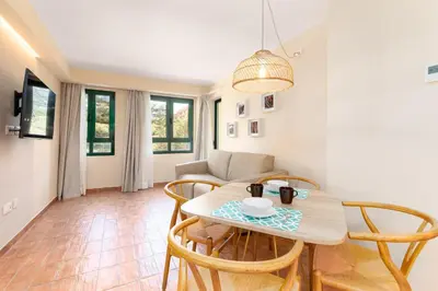 a dining room with a table and chairs at Apartamentos Las Ciencias J in Valencia