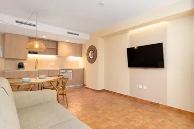 a living room with a couch and a table at Apartamentos Las Ciencias K in Valencia