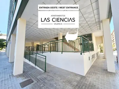 a building with a sign that reads las germaris wa at Apartamentos Las Ciencias B in Valencia