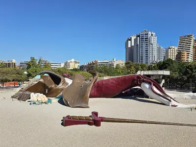 a sculpture of a person laying on the ground at Apartamentos Las Ciencias B in Valencia