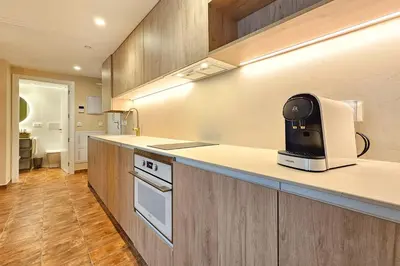 a kitchen with a toaster sitting on a counter at Apartamentos Las Ciencias Studio G in Valencia