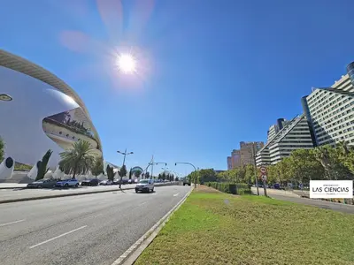 a city street with a car driving down a road at Apartamentos Las Ciencias Studio G in Valencia
