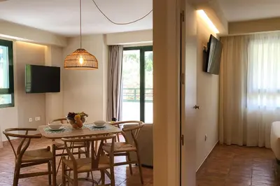 a dining room with a table and chairs in a room at Apartamentos Las Ciencias D in Valencia