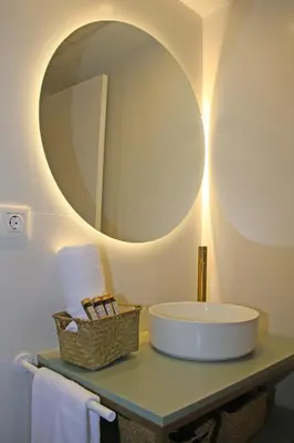 a bathroom with a sink and a large mirror at Apartamentos Las Ciencias D in Valencia