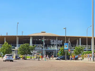 a large building with people walking in front of it at Apartamentos Las Ciencias D in Valencia