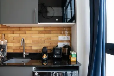 a kitchen counter with a sink and a microwave at Precioso Loft en Valencia in Valencia