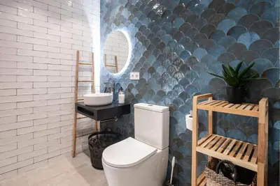 a bathroom with a toilet and a sink and a mirror at Precioso Loft en Valencia in Valencia