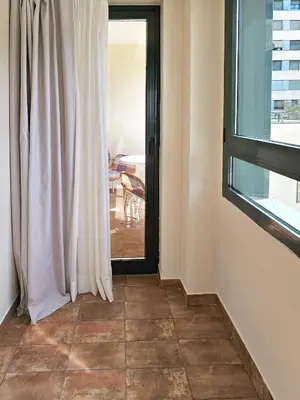 a room with a window and a tiled floor at Apartamentos Las Ciencias Ñ in Valencia