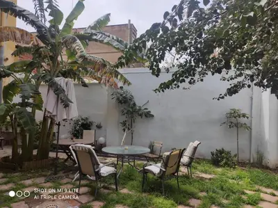 a patio with a table and chairs in a yard at 4 - Acogedora habitación junto a Ruzafa con baño privado y aire acondicionado in Valencia