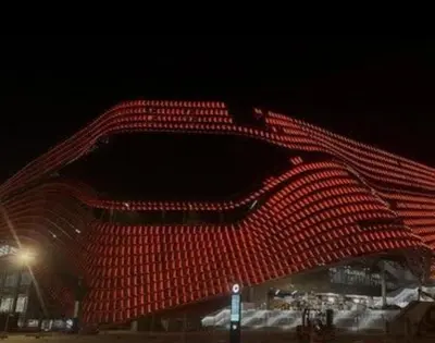 a building with red lights on it at night at 4 - Acogedora habitación junto a Ruzafa con baño privado y aire acondicionado in Valencia