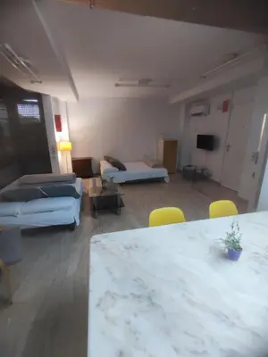 a large living room with a couch and a table at Bright loft near the sea + BIKES in Valencia