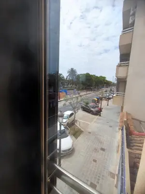 a view of a city street from a window at Bright loft near the sea + BIKES in Valencia
