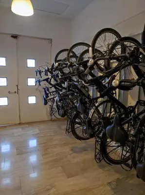 a bunch of bikes parked in a room at Close to the sea, large (170 m2) apartment+BIKES in Valencia