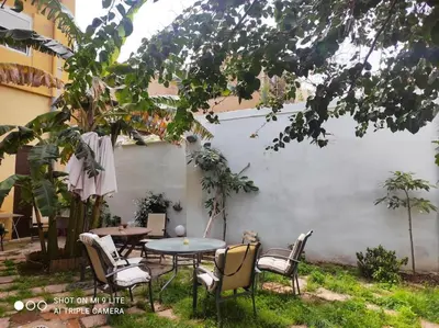 a patio with a table and chairs in a yard at Cozy apartamento en Ruzafa para 2-3 personas con aire acondicionado y salida directa a terraza in Valencia