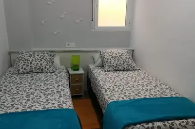 two beds sitting next to each other in a room at Oceanográfico, Playa, Puerto Juanjo in Valencia