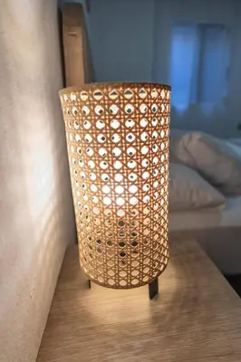 a lamp sitting on top of a wooden table at La casita de pescadores by Concept Flats in Valencia