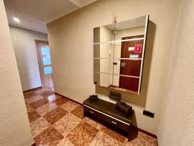 a dressing room with a mirror and a counter at Bonito y grande apartamento cerca de la playa in Valencia