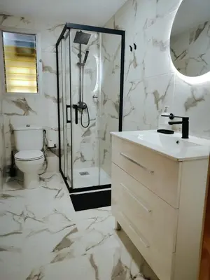 a bathroom with a shower and a sink and a toilet at Florazar I frente a la playa in Cullera