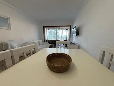 a room with a table with a basket on it at Florazar I frente a la playa in Cullera