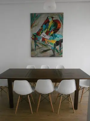 a dining room table with white chairs and a painting at Total Valencia Terrace in Valencia
