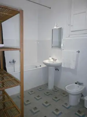 a white bathroom with a sink and a toilet at Total Valencia Terrace in Valencia